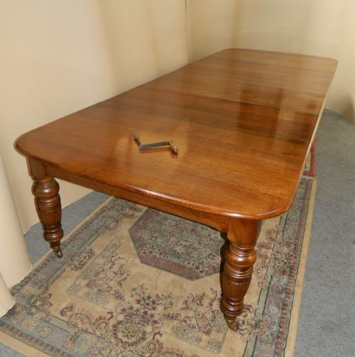 fig 1. extending oak dining table with 4 leaves