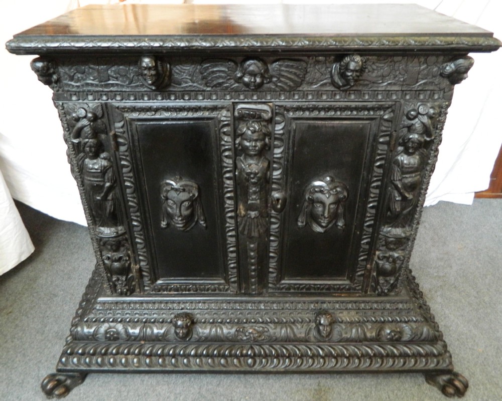 unusual carved oak cupboard