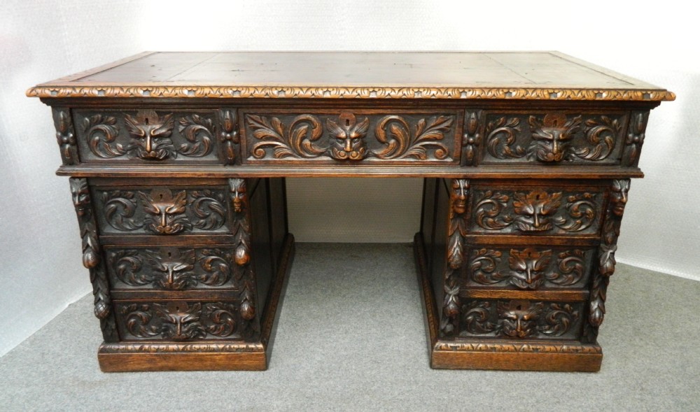 carved oak green man desk