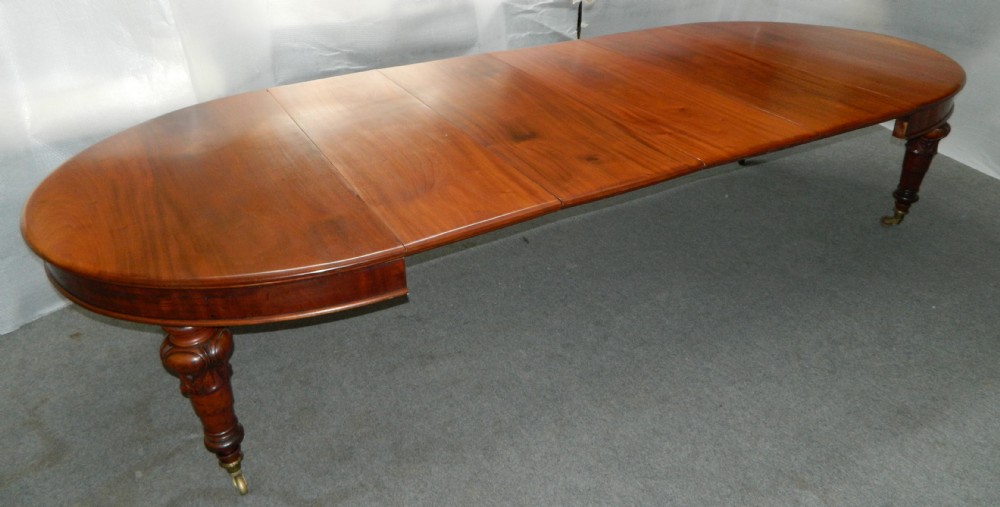 large mahogany extending dining table with leaf carrier