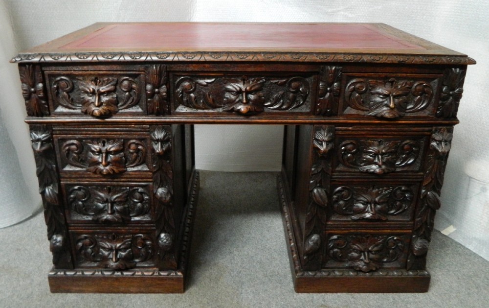 carved oak green man desk