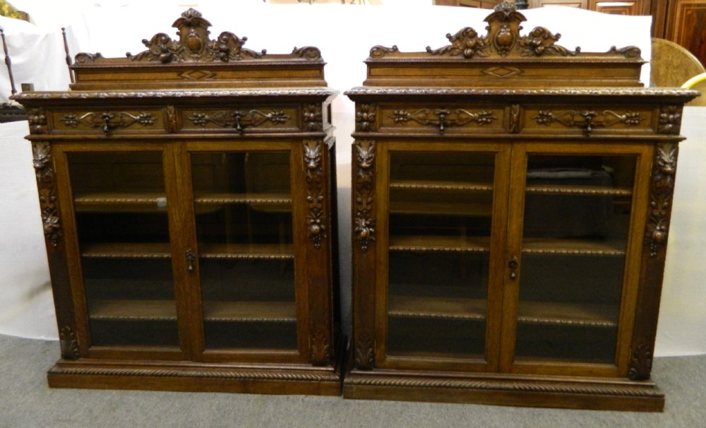 pair of carved oak bookcases