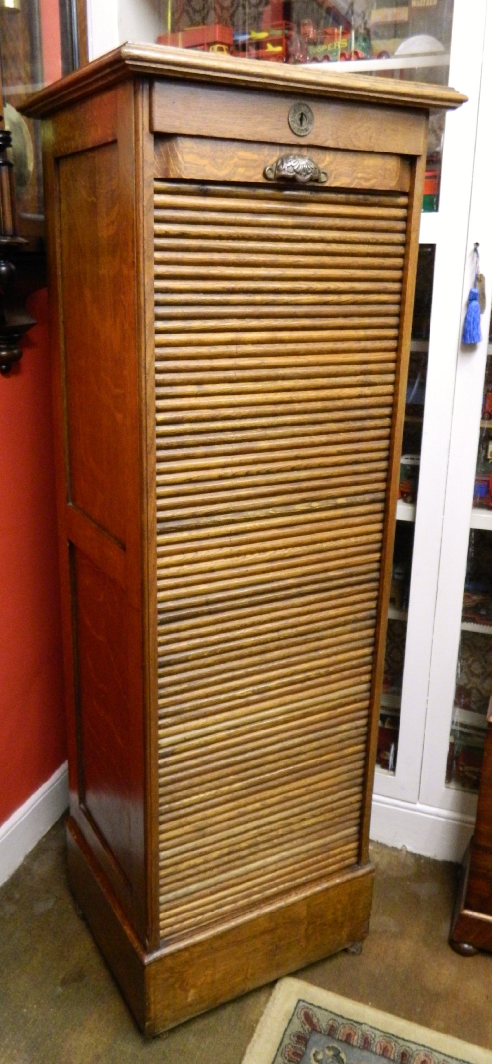 tall oak tambour front filing cabinet