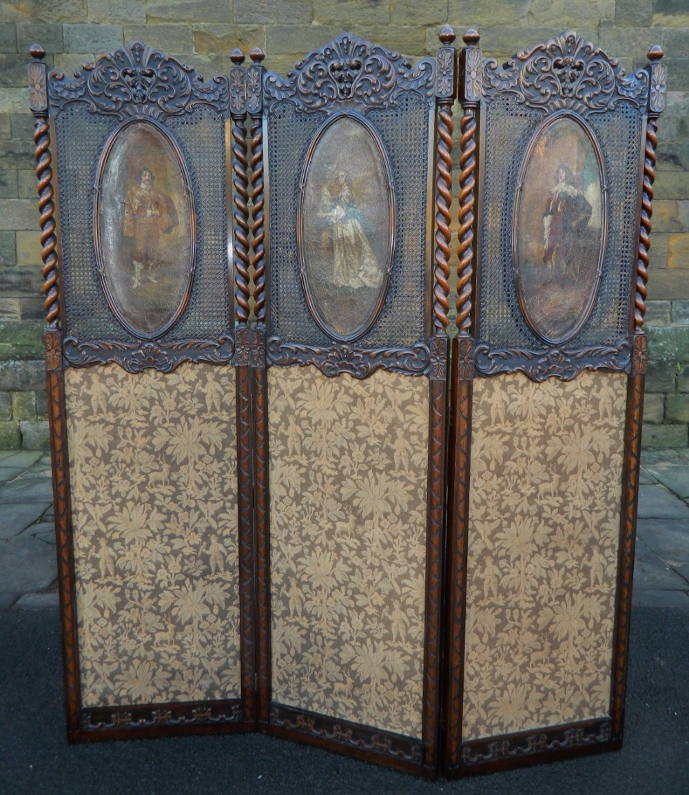large carved oak three fold room screen