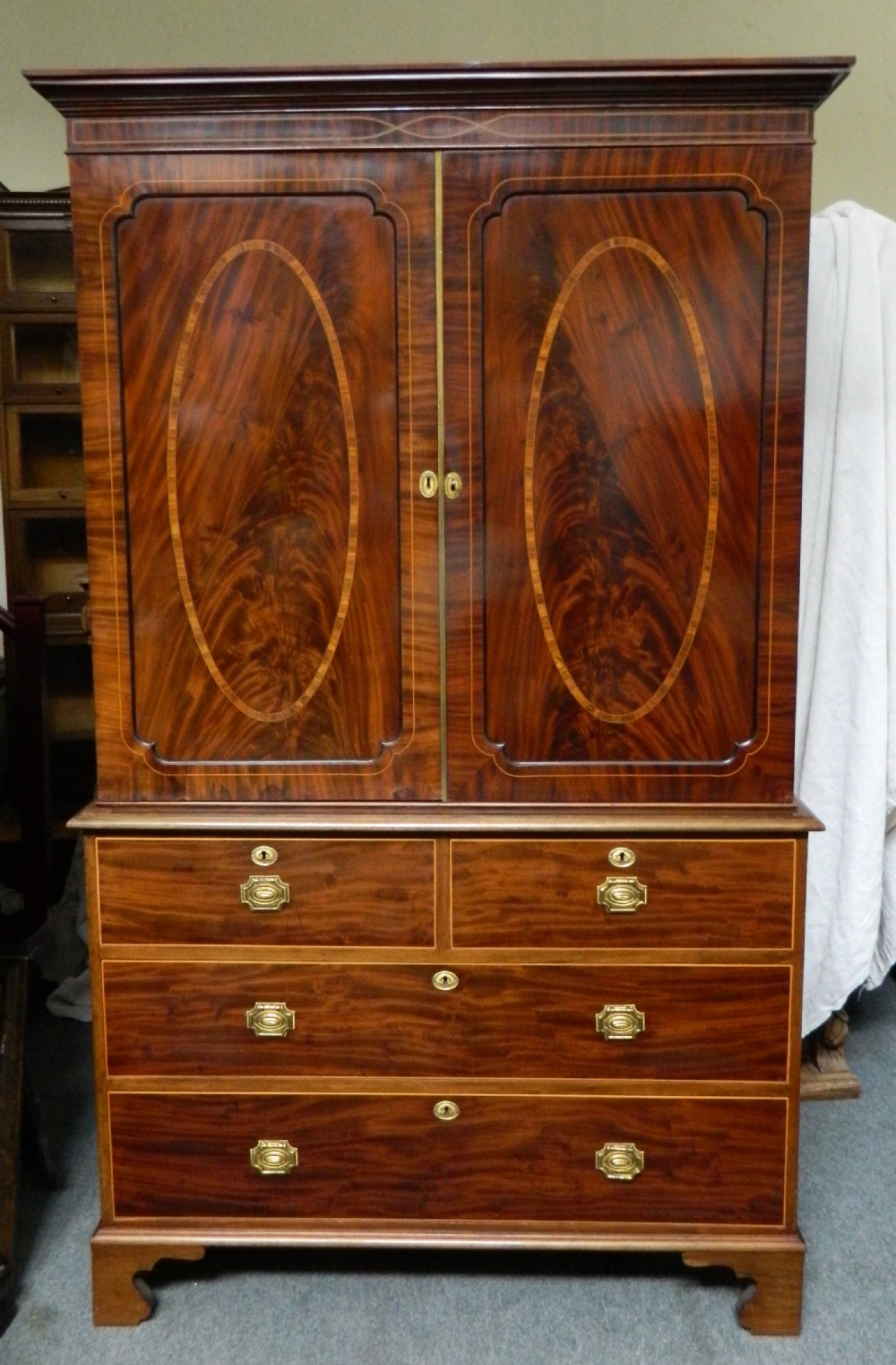inlaid mahogany linen press
