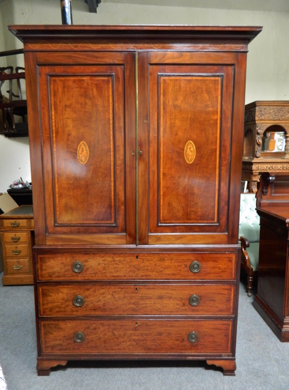 Inlaid mahogany linen press