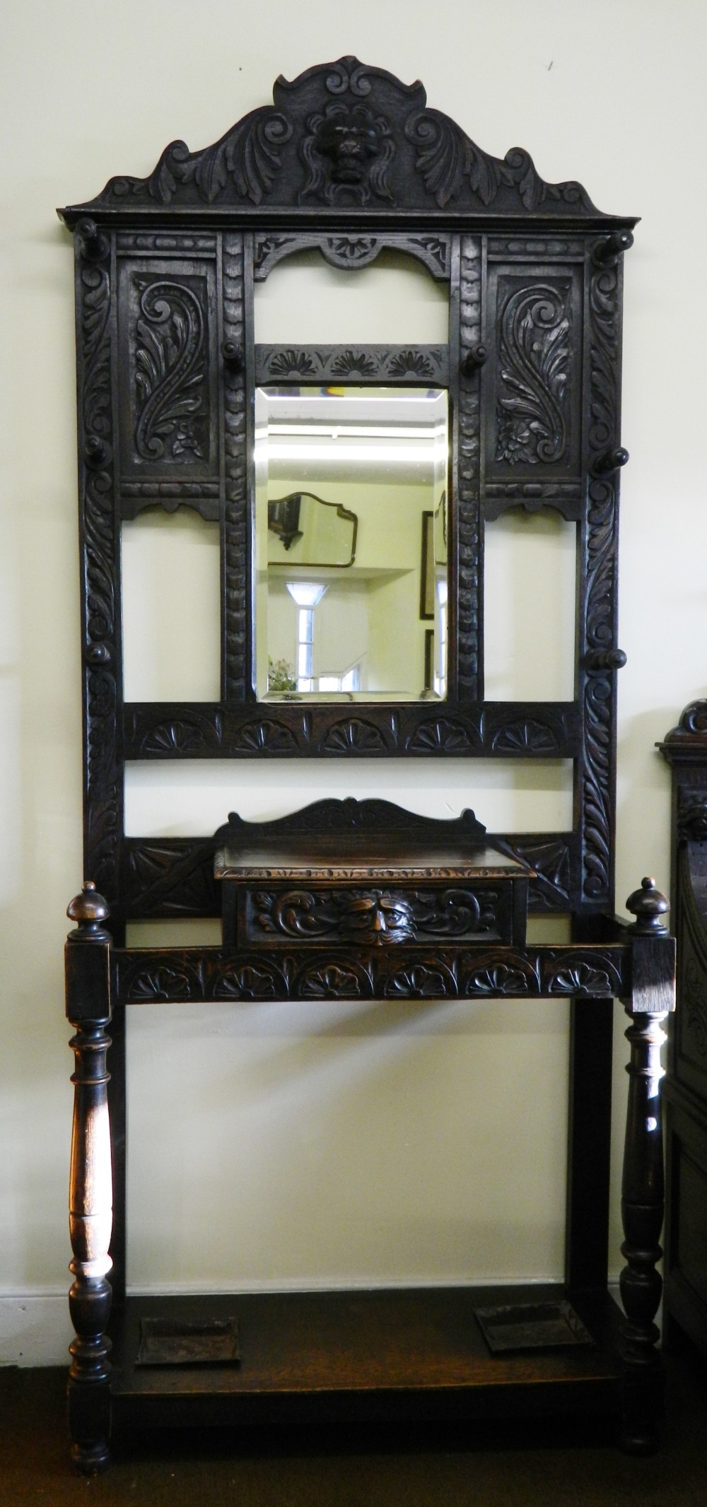 Carved oak green man hall stand
