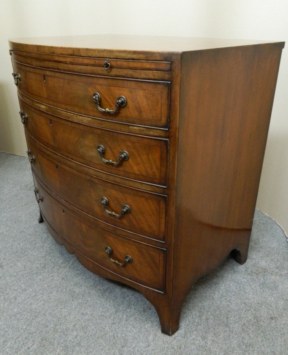 small mahogany bowfront chest of drawers with brushing slide View II