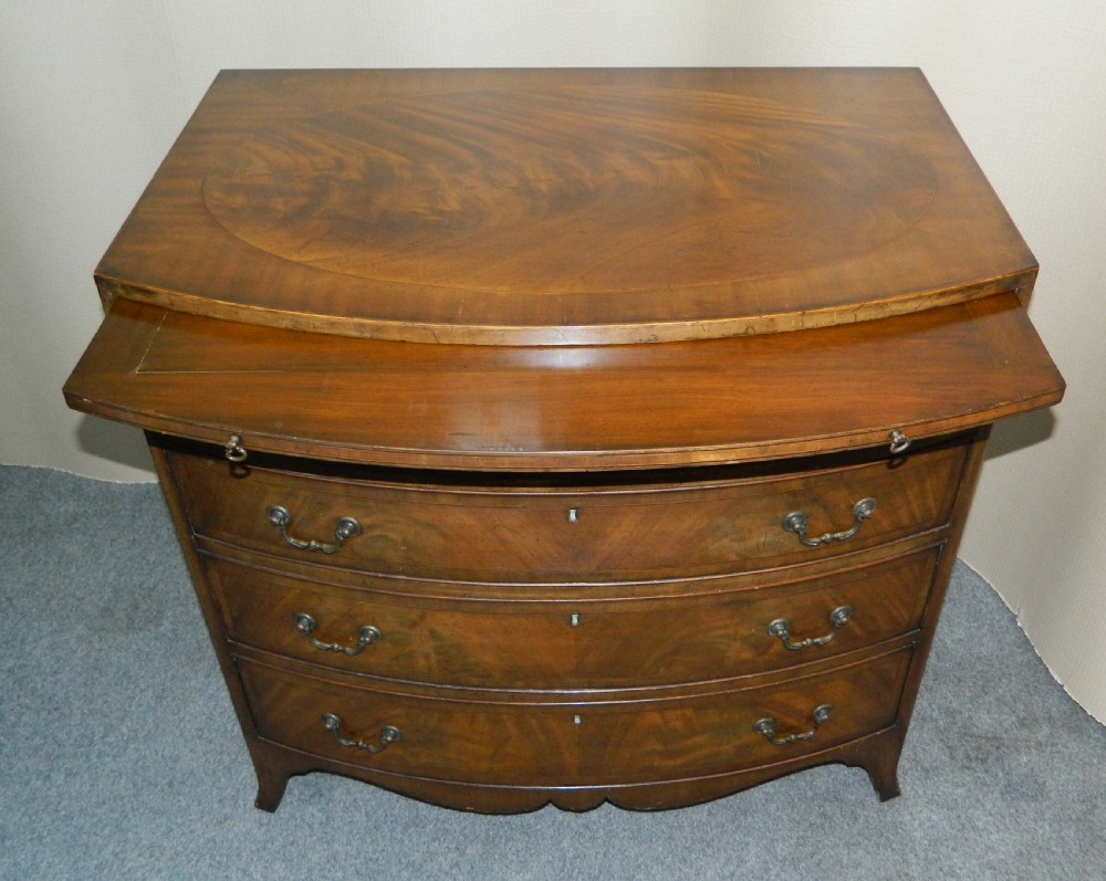 small mahogany bowfront chest of drawers with brushing slide View V