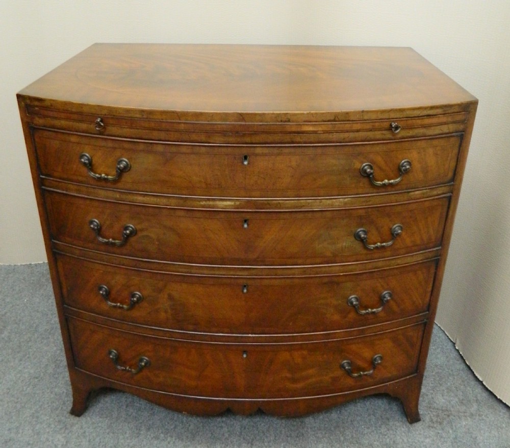 small mahogany bowfront chest of drawers with brushing slide View VI