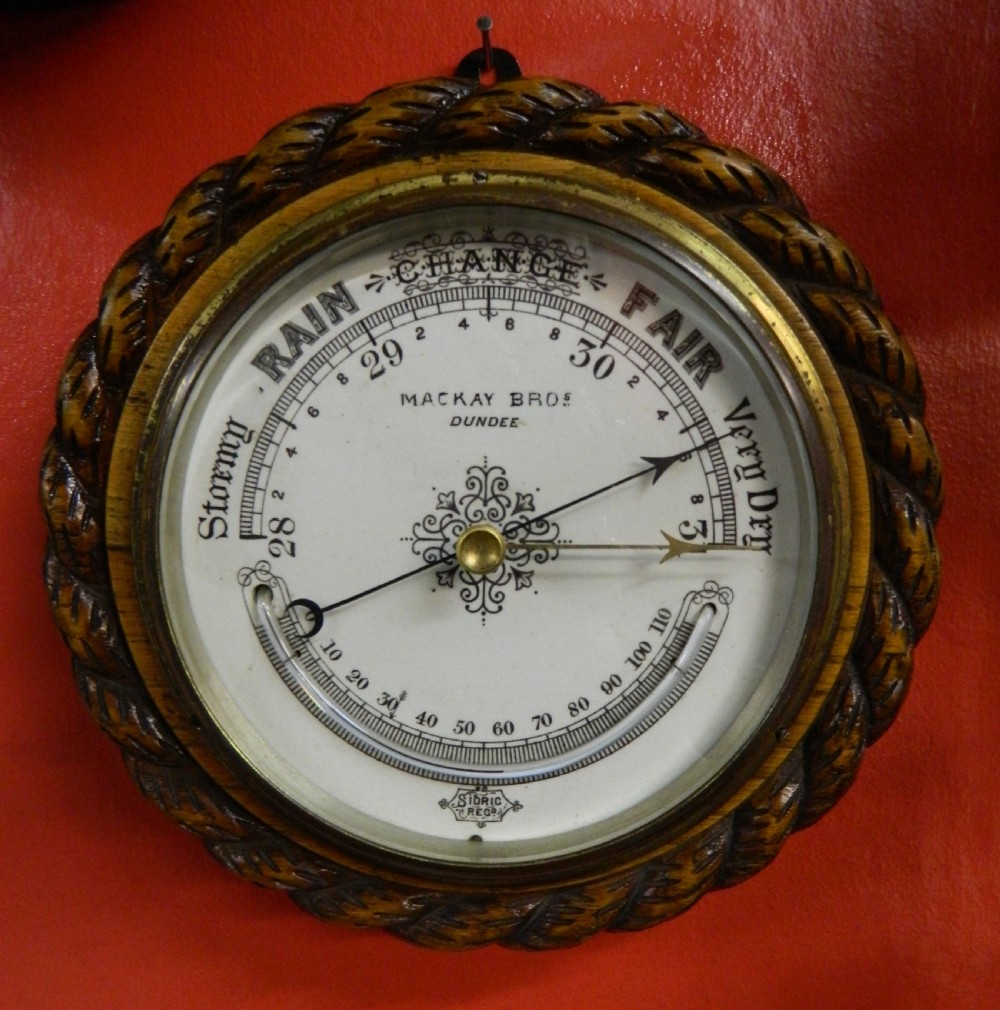 carved oak rope twist aneroid barometer