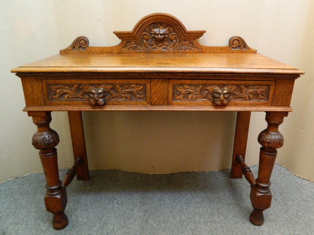 carved oak green man table