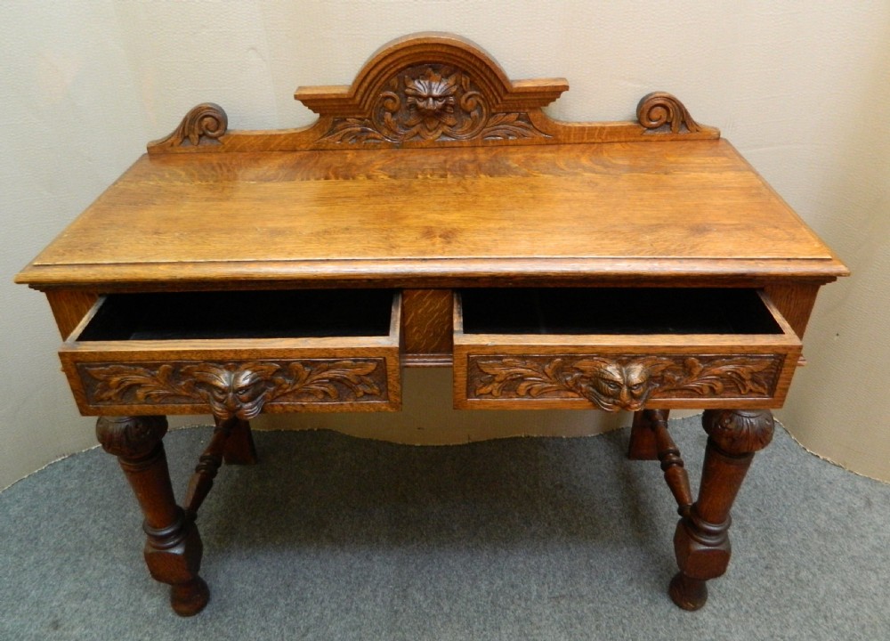 carved oak green man table View V