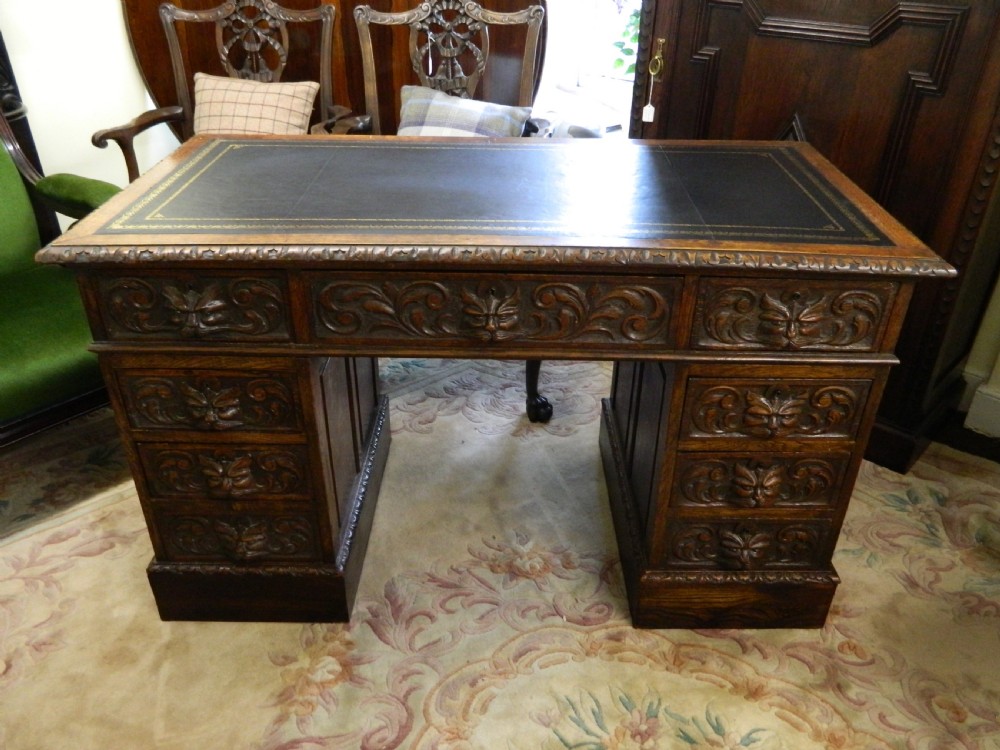Carved oak green man desk