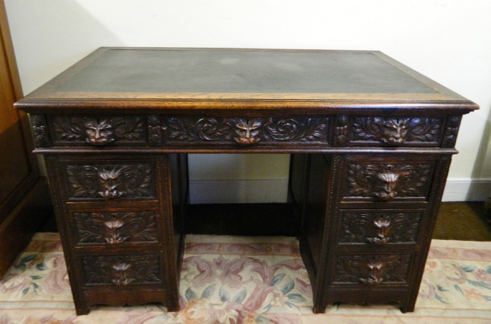 Carved oak green man desk