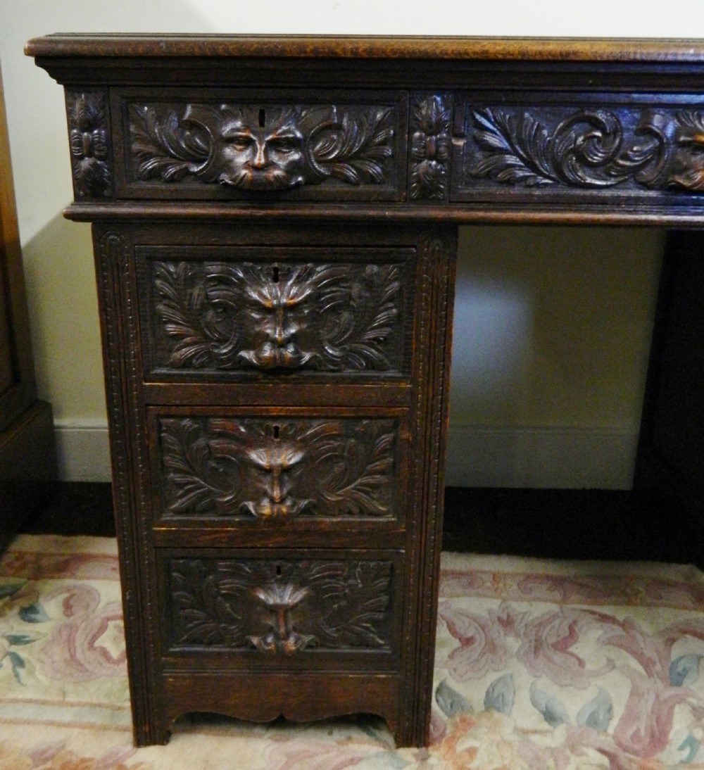 Carved oak green man desk View IV
