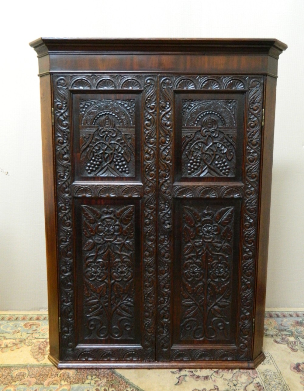 carved oak corner cupboard