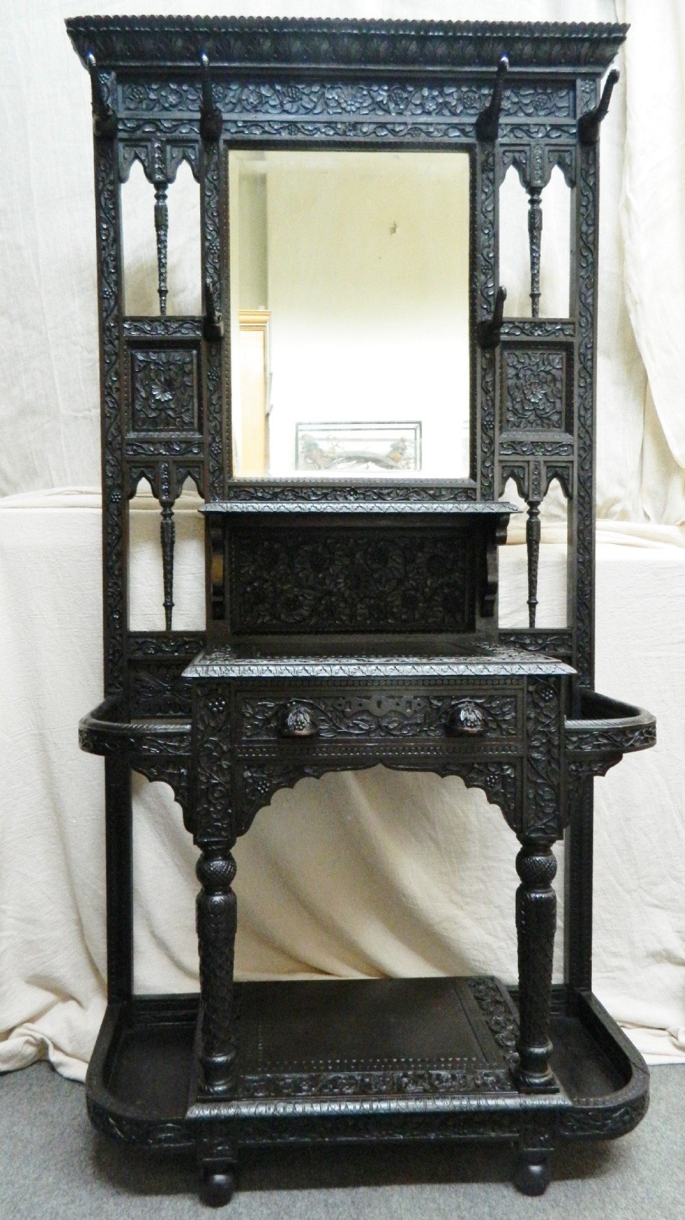 unusual hall stand with elephant trunk pegs
