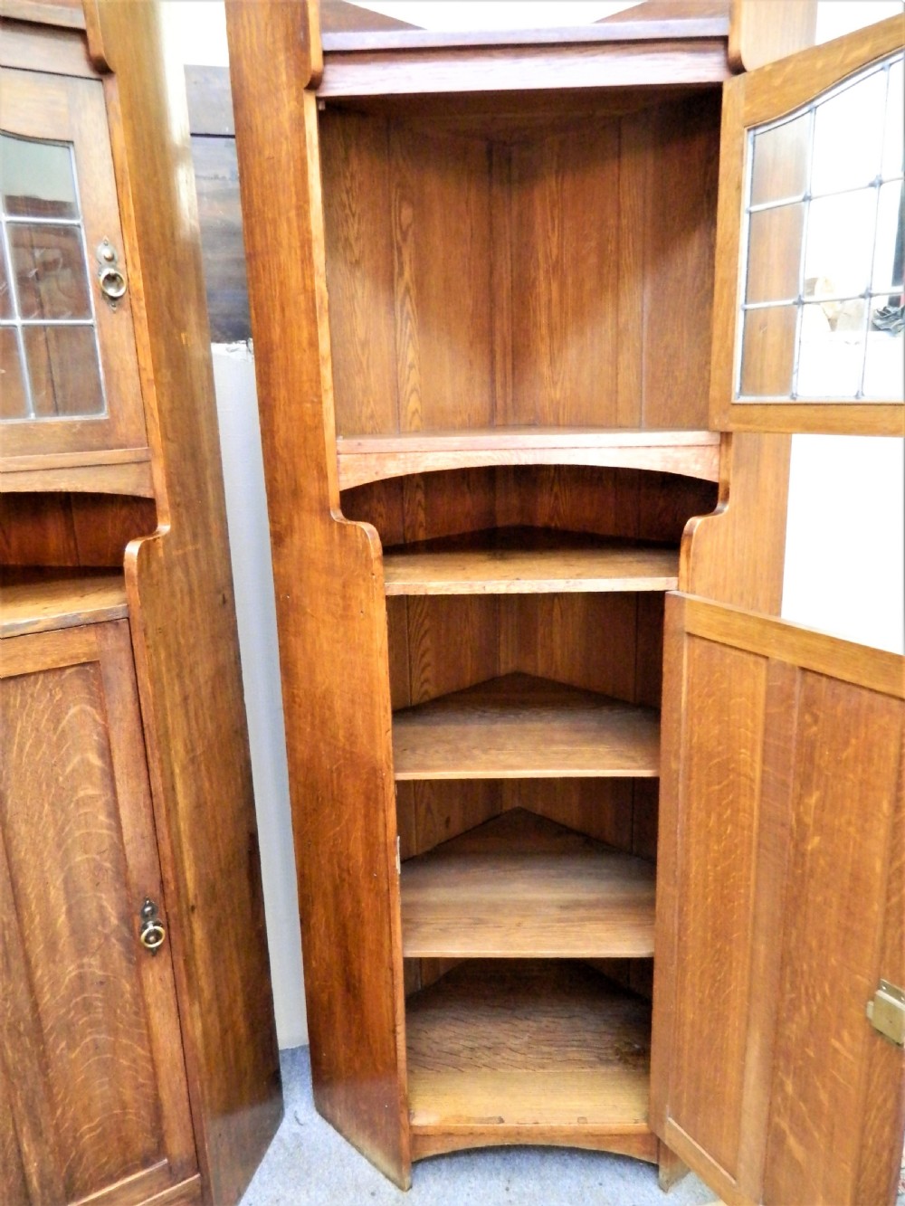 pair of oak Arts & Crafts cabinets in the manner of Liberty View V