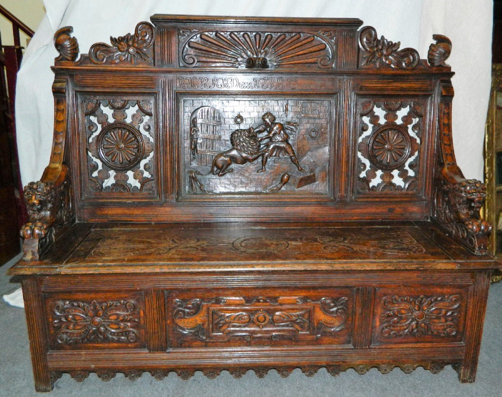 Carved oak settle