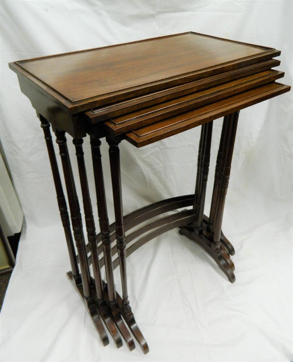 nest of four mahogany tables