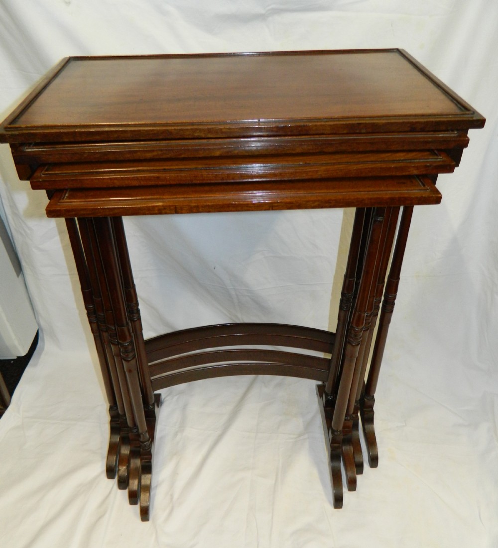 nest of four mahogany tables View II