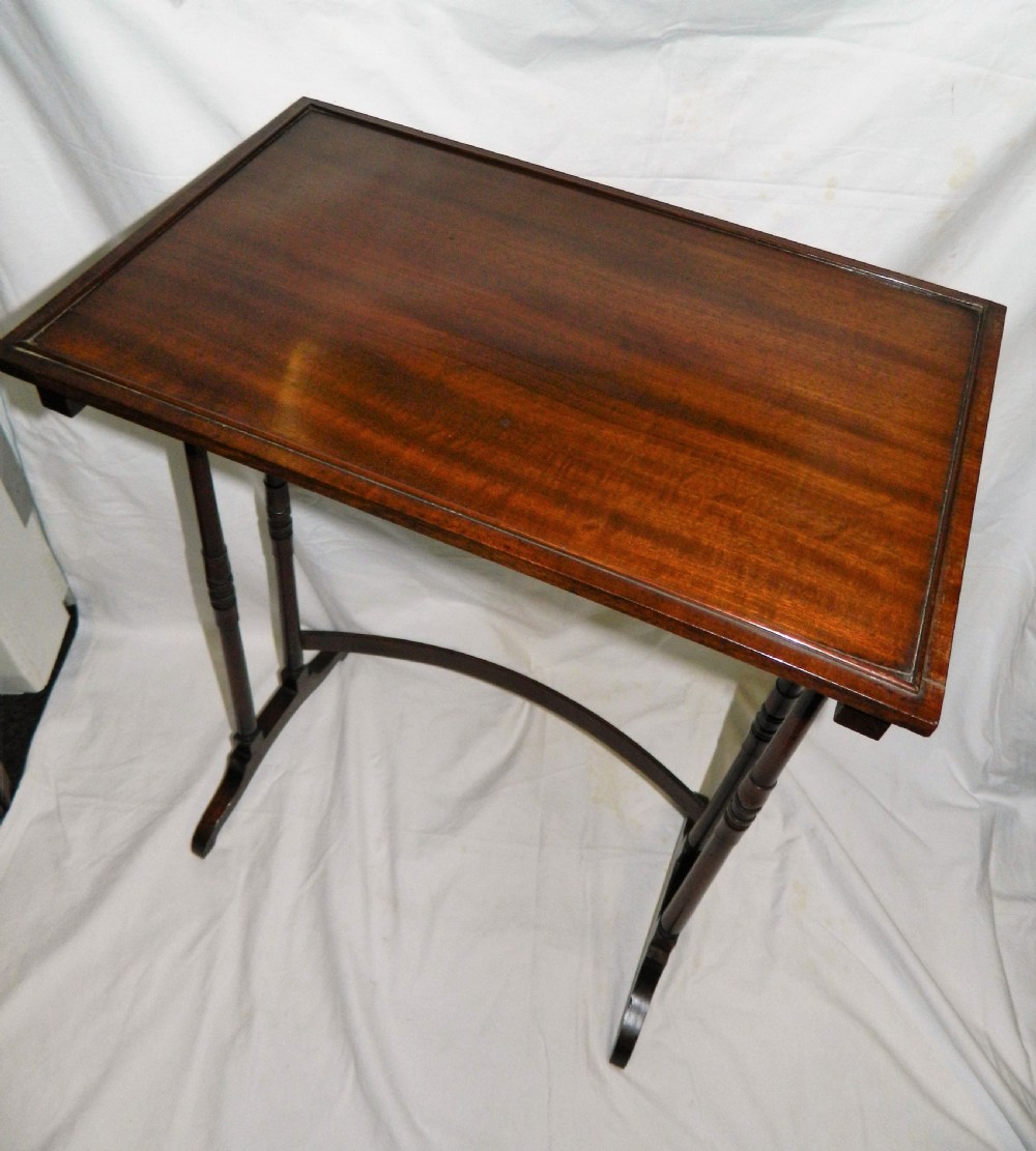 nest of four mahogany tables View VI