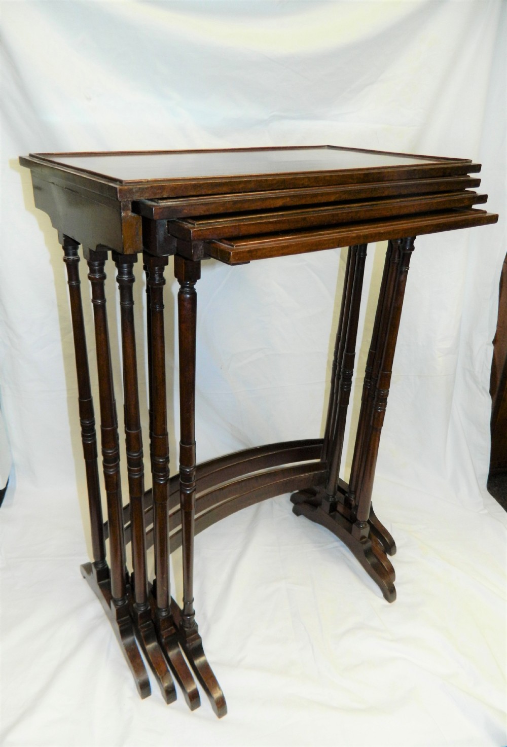 nest of four mahogany tables View IX