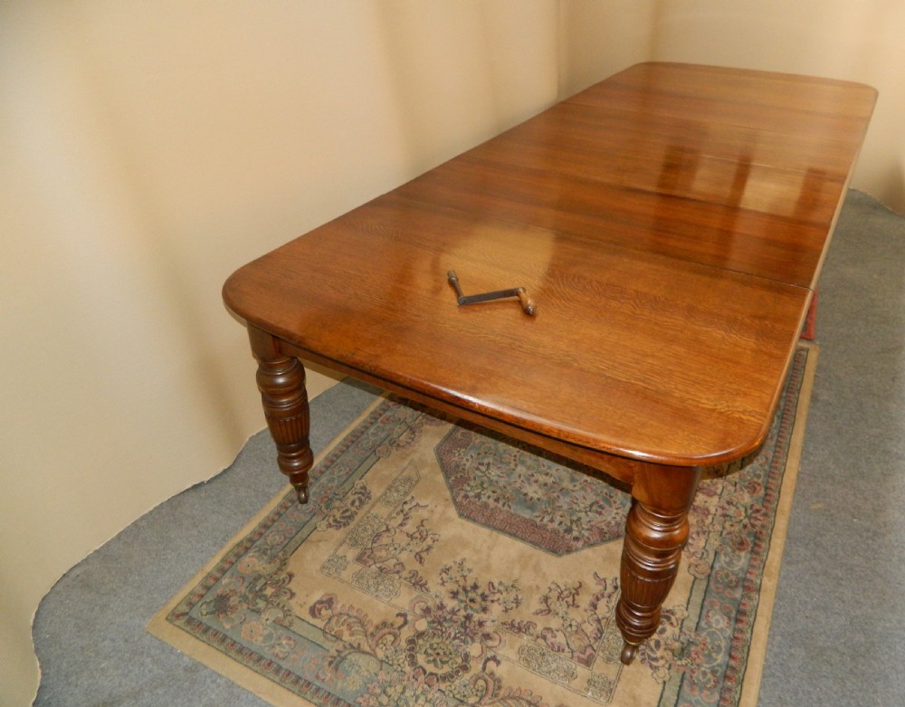 extending oak dining table with 4 leaves View III