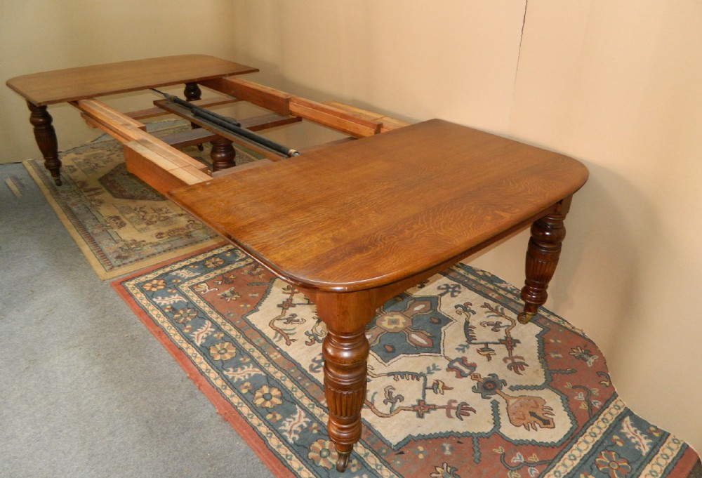 extending oak dining table with 4 leaves View X