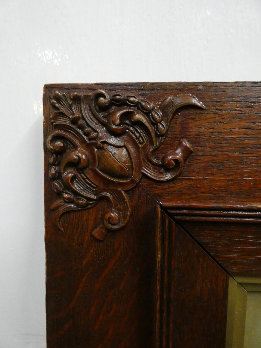 Pair of antique framed sepia family portraits housed within carved dark oak frames featuring inner gold gilt borders. View VI