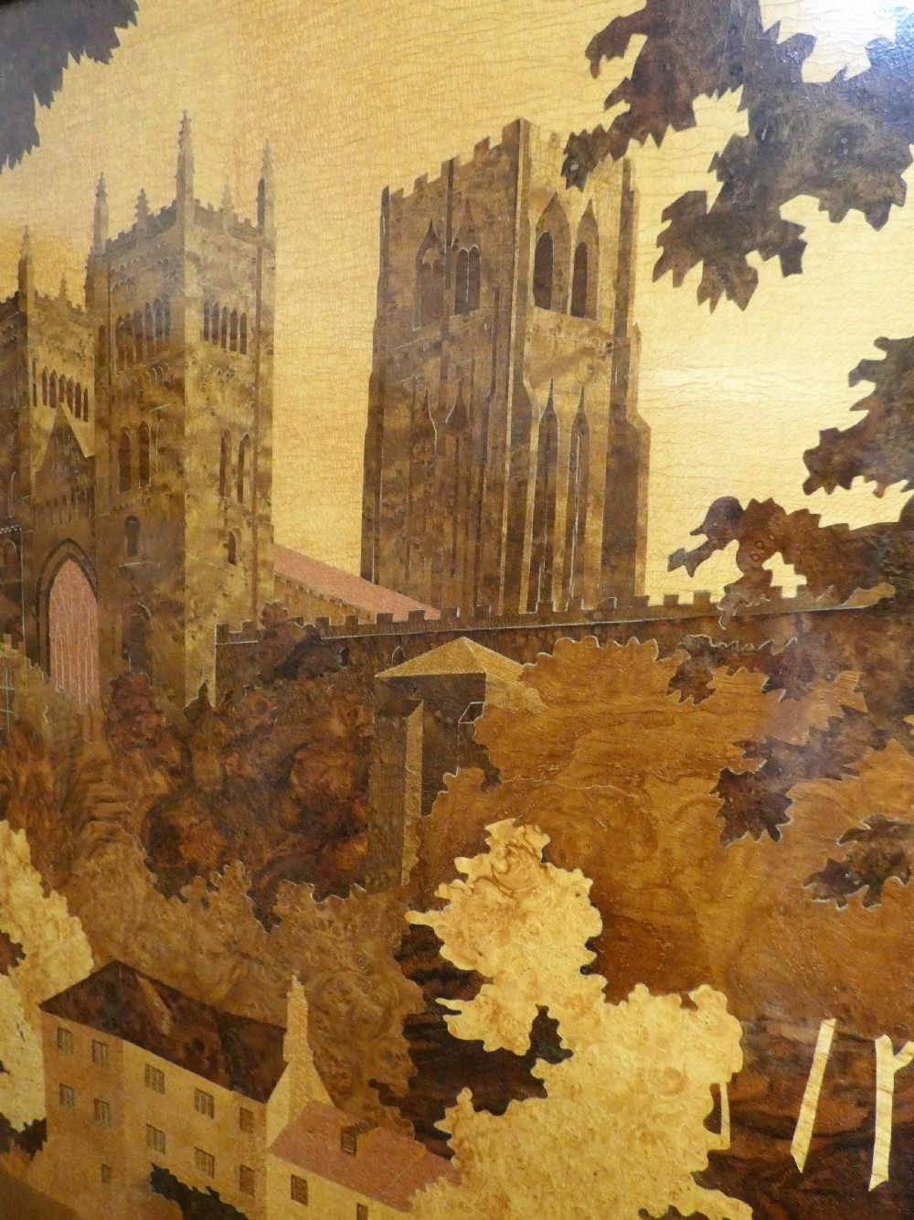 A rectangular wood marquetry wall panel depicting Durham Cathedral rendered in contrasting shades of natural wood veneer. View III