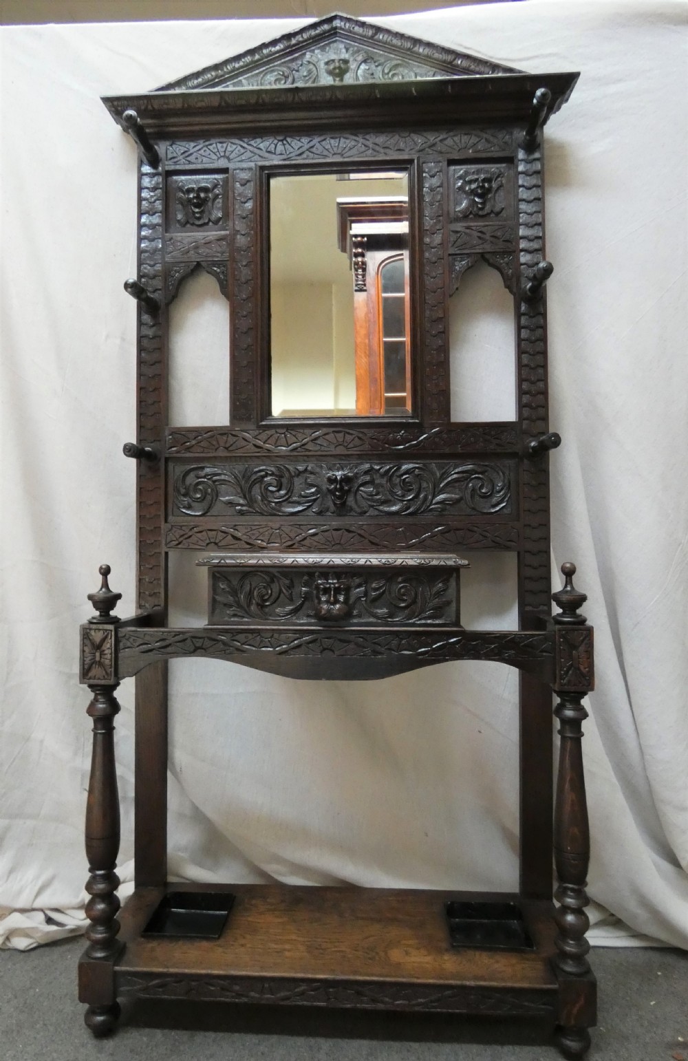 Carved oak green man hall stand