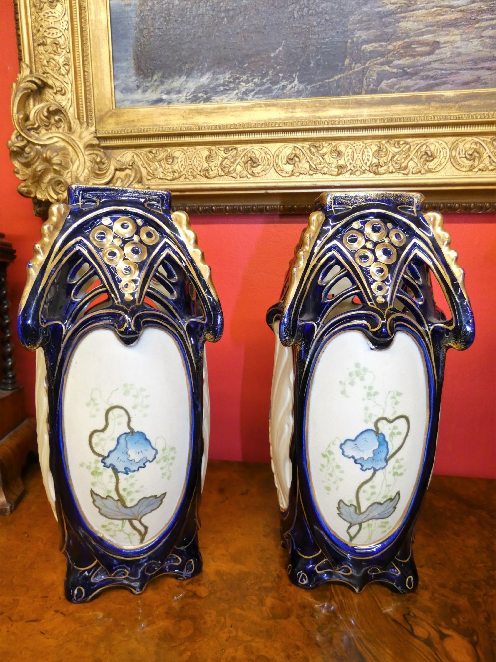 A pair of Art Nouveau ceramic vases with reticulated cobalt blue and gilt borders around hand-painted blue floral panels. View III