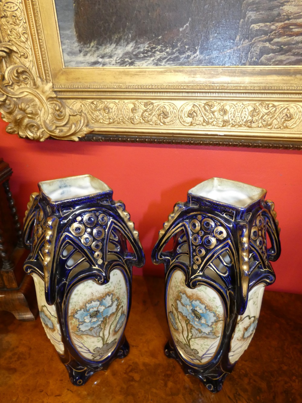 A pair of Art Nouveau ceramic vases with reticulated cobalt blue and gilt borders around hand-painted blue floral panels. View VIII