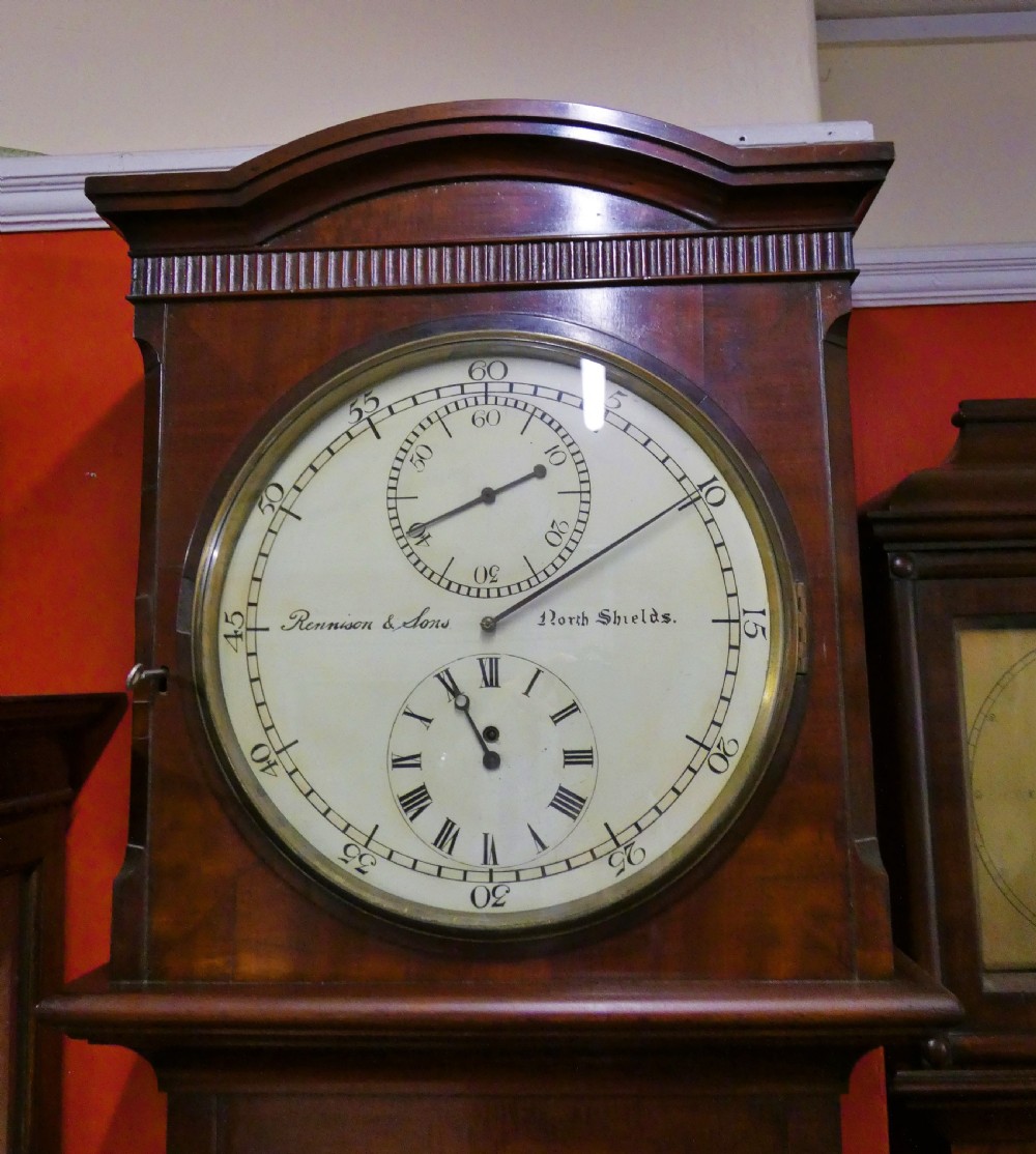A Victorian mahogany longcase regulator clock featuring a circular dial with subsidiary dials and a glazed trunk displaying a mercury pendulum. View V