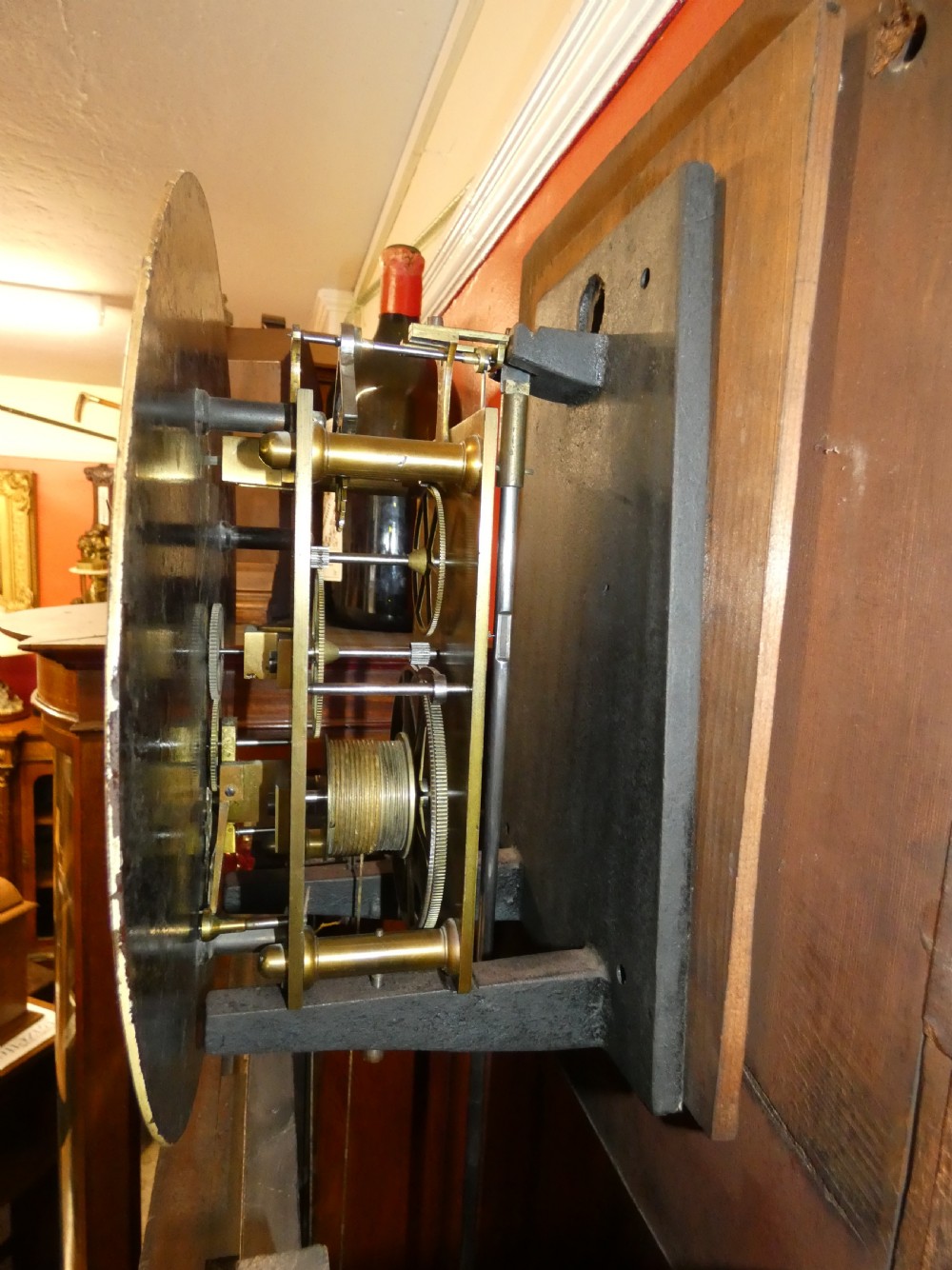 A Victorian mahogany longcase regulator clock featuring a circular dial with subsidiary dials and a glazed trunk displaying a mercury pendulum. View IX