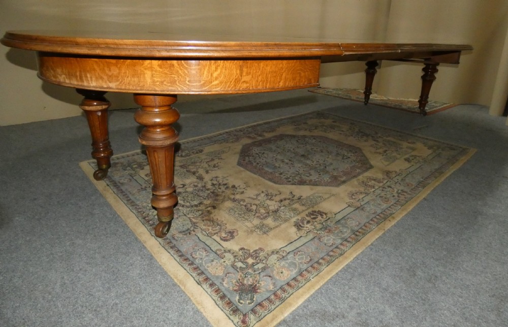 12ft extending oak dining table with 4 leaves View VII