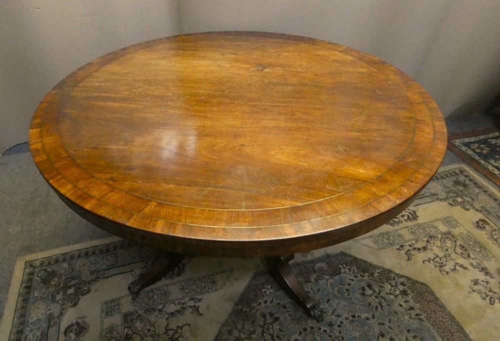 Regency mahogany centre table with brass inlay View II