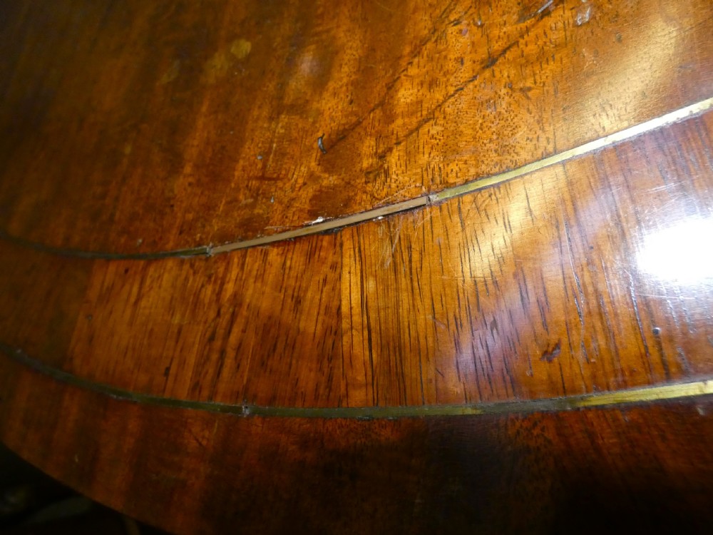 Regency mahogany centre table with brass inlay View X