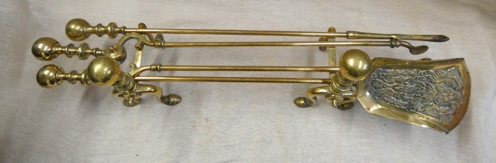 Brass andirons with set of fire tools View II