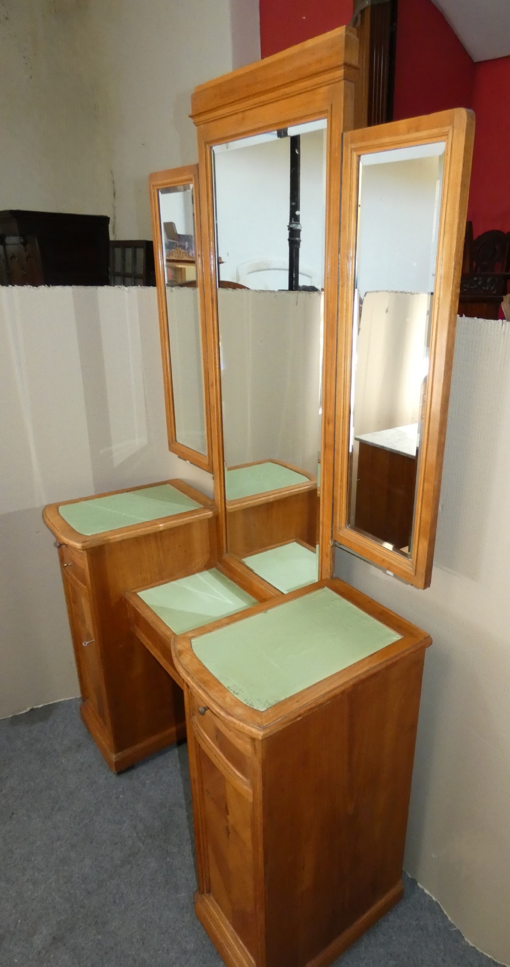 A satinwood dressing table featuring a central tall mirror flanked by two adjustable wing mirrors, twin pedestal cupboards with geometric star motif parquetry, and a central drawer. View VIII