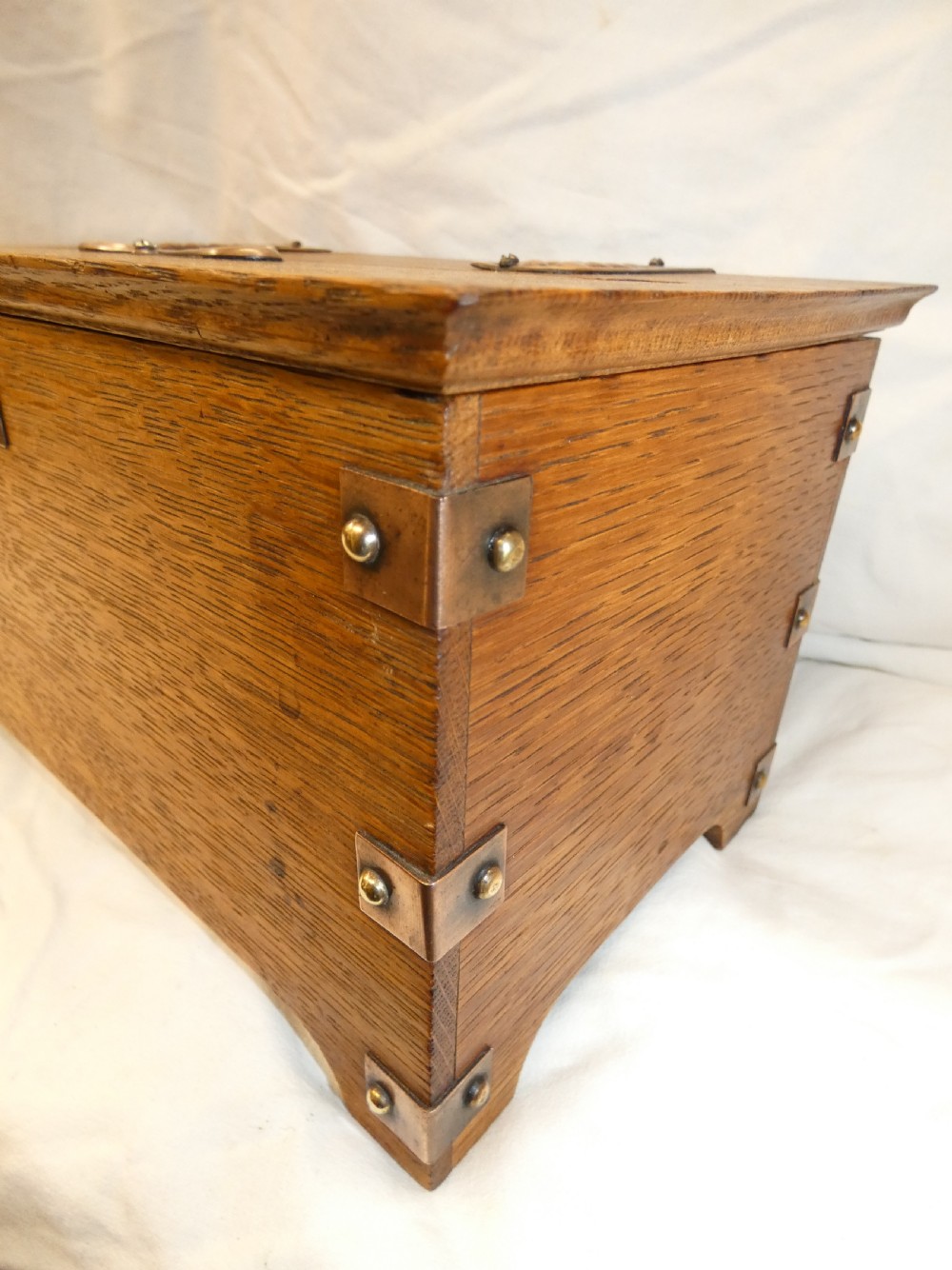 An antique Arts and Crafts solid oak letter box featuring decorative copper strap hinges, corner brackets, a top letter slot, and a central embossed copper plaque reading LETTERS. View VI