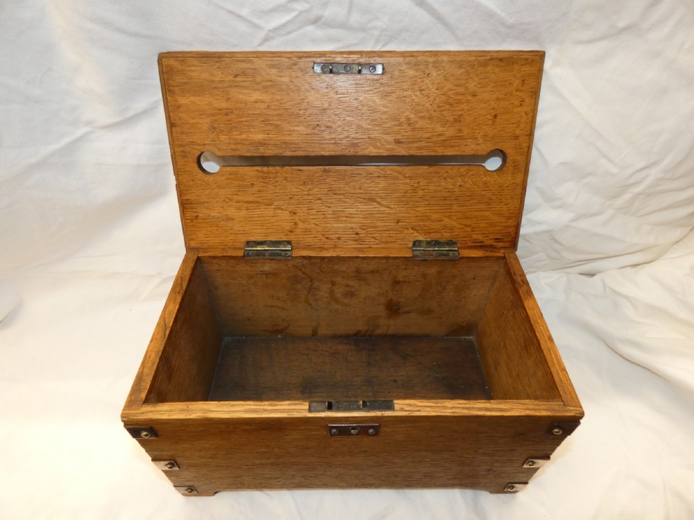 An antique Arts and Crafts solid oak letter box featuring decorative copper strap hinges, corner brackets, a top letter slot, and a central embossed copper plaque reading LETTERS. View VII