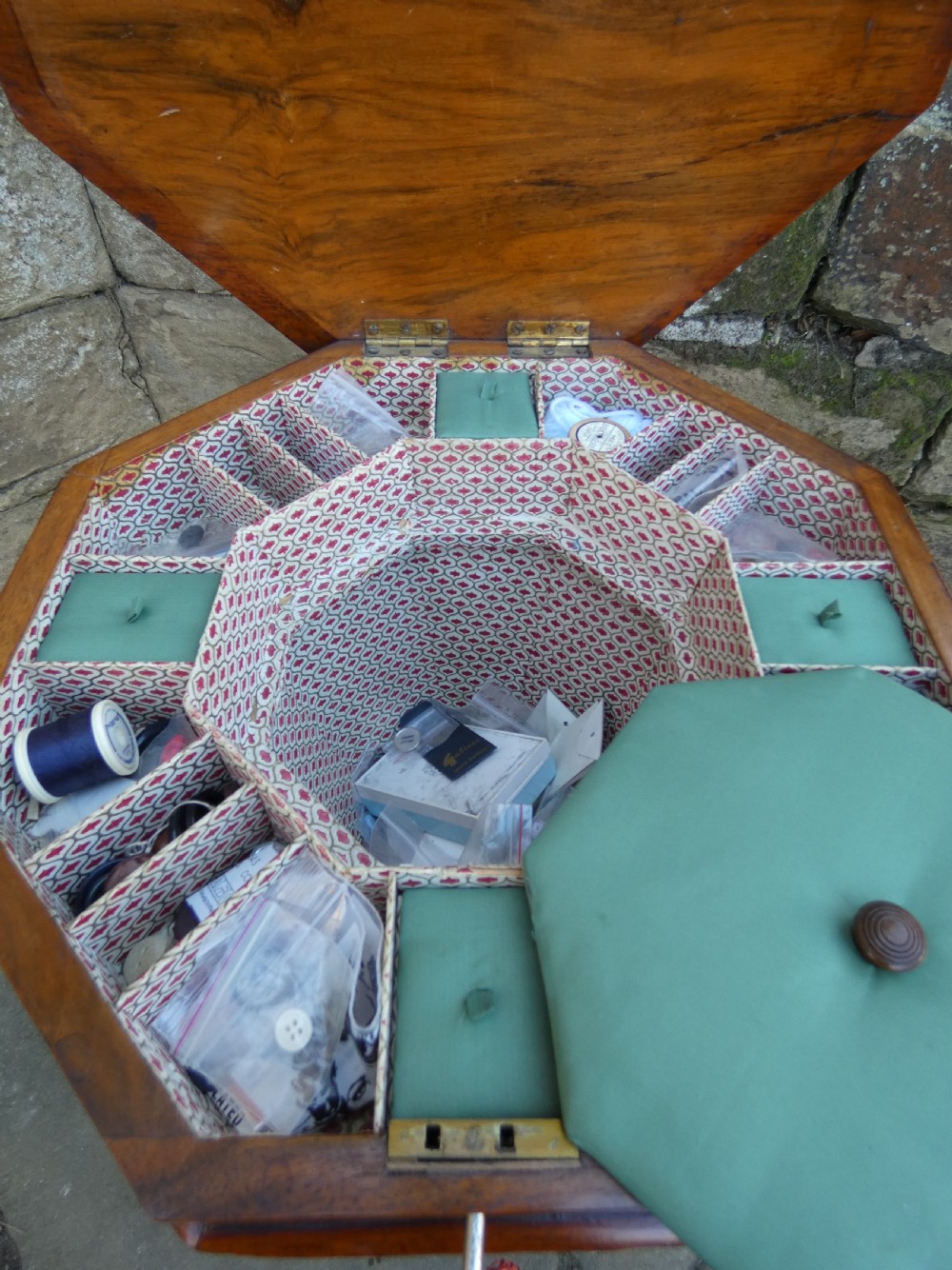 An octagonal Victorian rosewood sewing table featuring floral marquetry inlay on the top, a tapered trumpet base, and carved tripod feet. View VII
