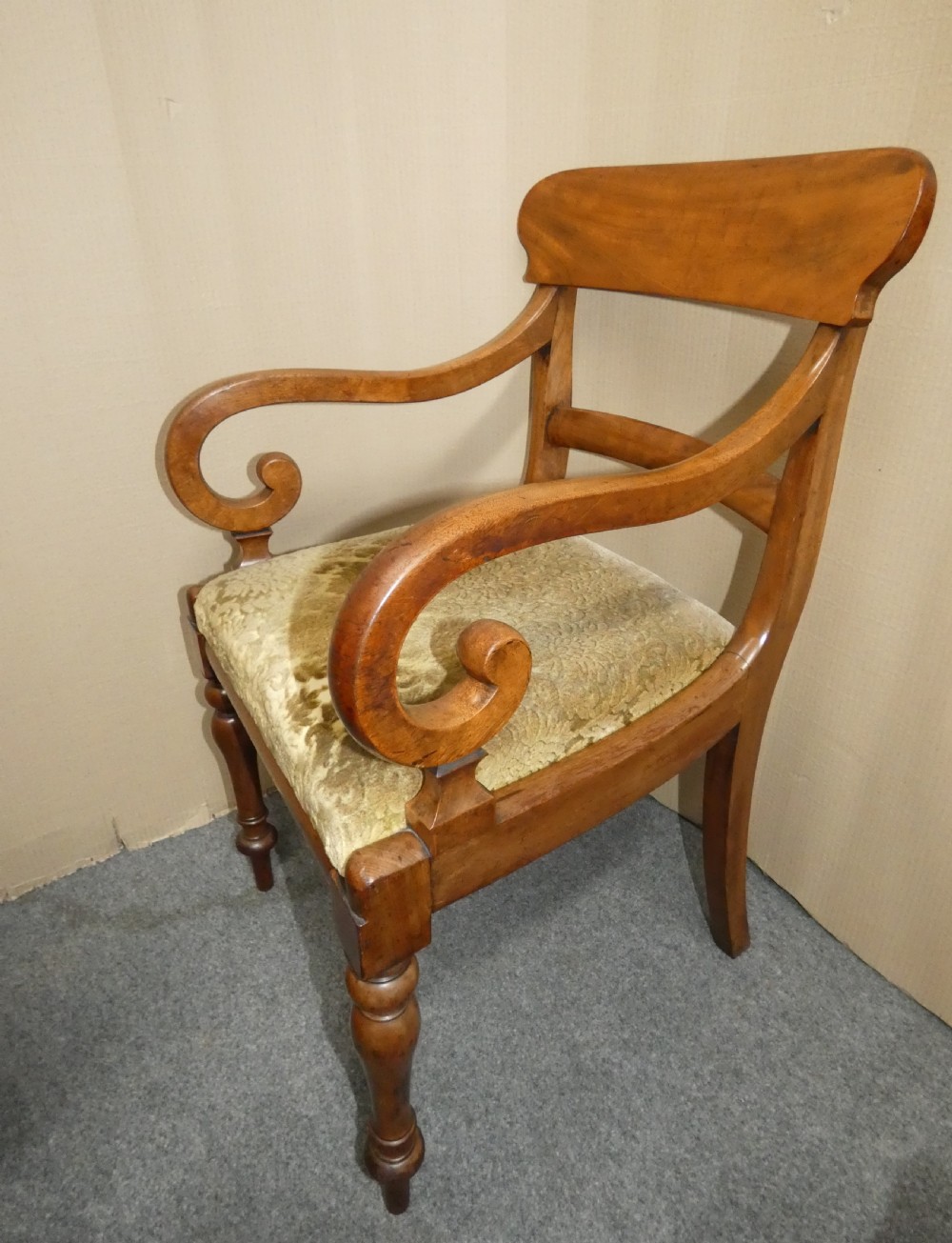 A set of eight antique mahogany dining chairs featuring curved bar backs, turned front legs, and mustard patterned fabric seats. View IV