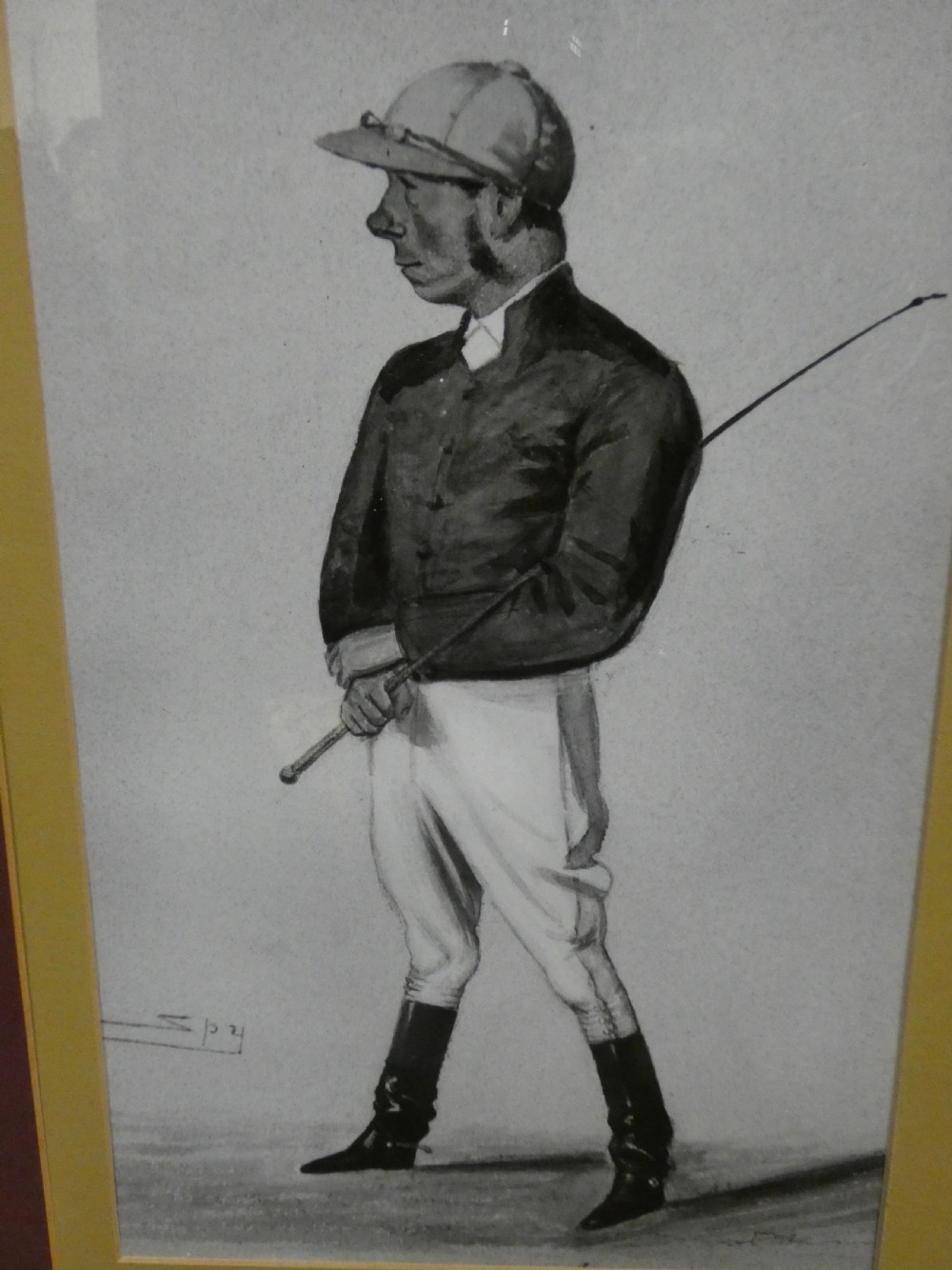 A set of six dark wooden frames, each housing two framed Victorian Vanity Fair caricature lithographs of gentlemen set against cream backgrounds with burgundy mounts. View XIII