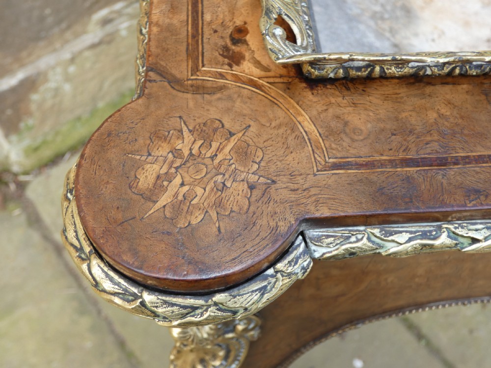 A French Louis XV style burr walnut jardiniere table with cabriole legs, ormolu mounts, a central porcelain plaque, and a brass gallery rim. View IV