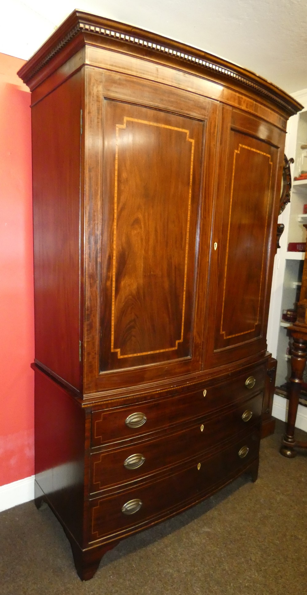 Mahogany bowfront linen press