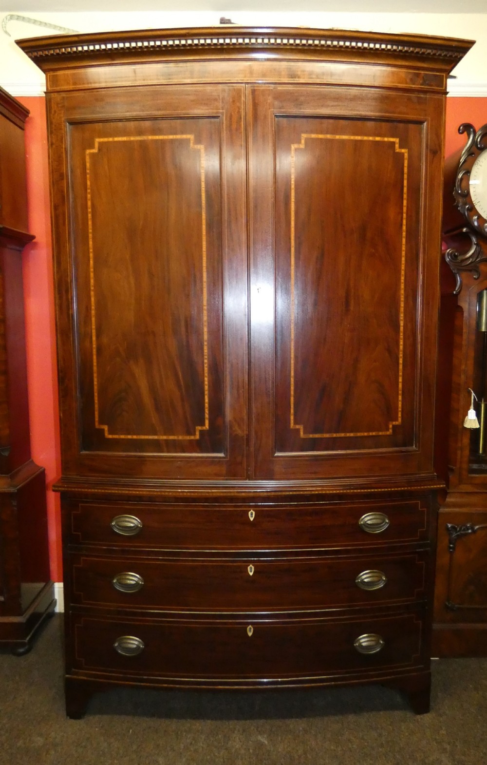 Mahogany bowfront linen press